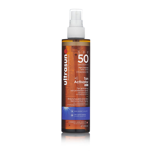 A bottle of Ultrasun Body Tan Activator Spray with SPF 50 protection, labeled for enhancing tan and protecting against the sun.